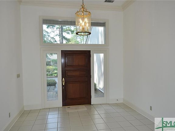 Foyer with gorgeous Mahogany front door