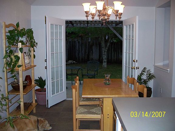 French Doors open to Shaded Backyard