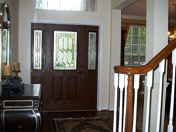 Extensive beautiful hardwood floors extend from the entry & through to the den.