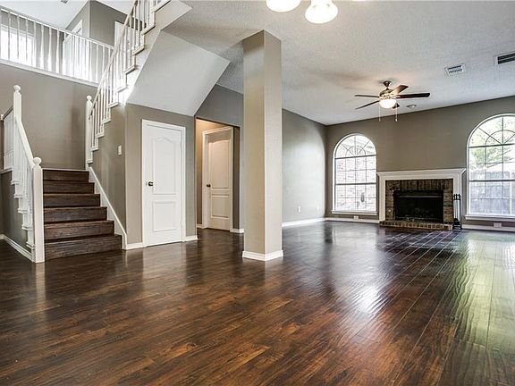 Versatile great room-dining room combination is nice and open and great for entertaining with pool views.