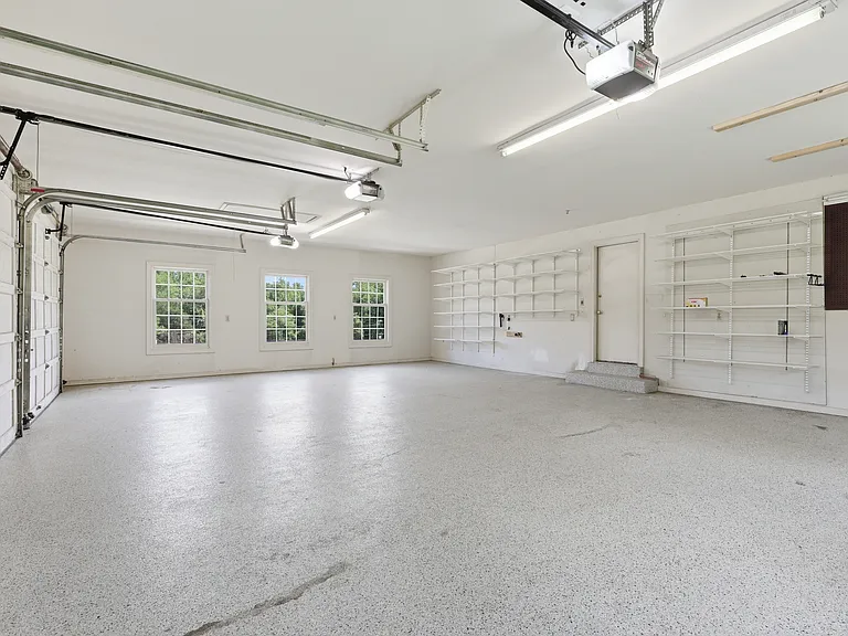 Three-car side-load garage with generous space.