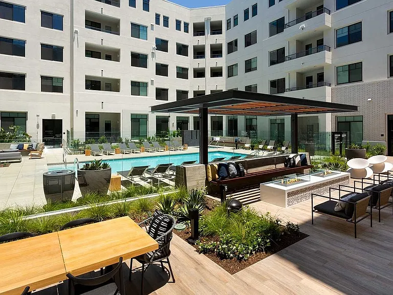 Pool, sundeck, and courtyard area