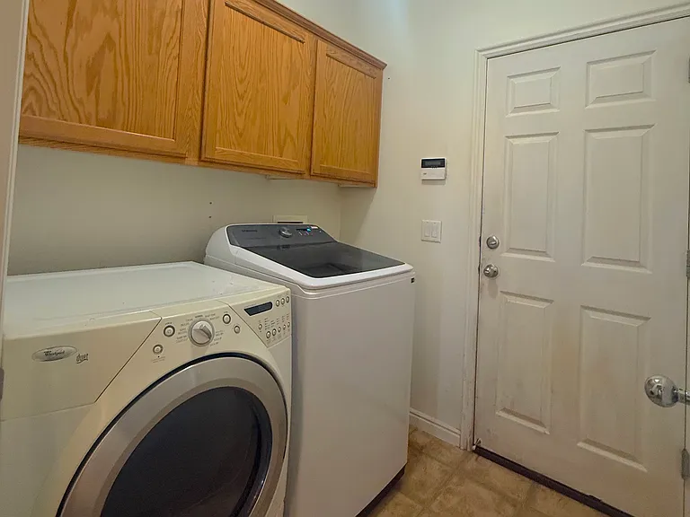 Laundry room with washer and dryer