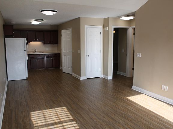 Living room looking into dining/kitchen area/spacious open floor plan