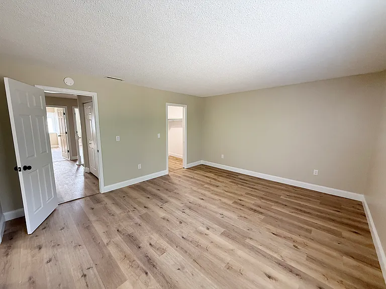 MASTER BEDROOM LOOKING INTO HALLWAY