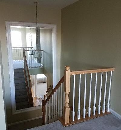 stairs leading to bedroom level, custom made mirror
