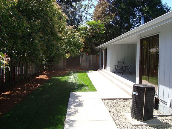 Back Yard with New Concrete Covered Pation and Walk