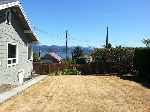 Large, side yard. Professionally landscaped.
