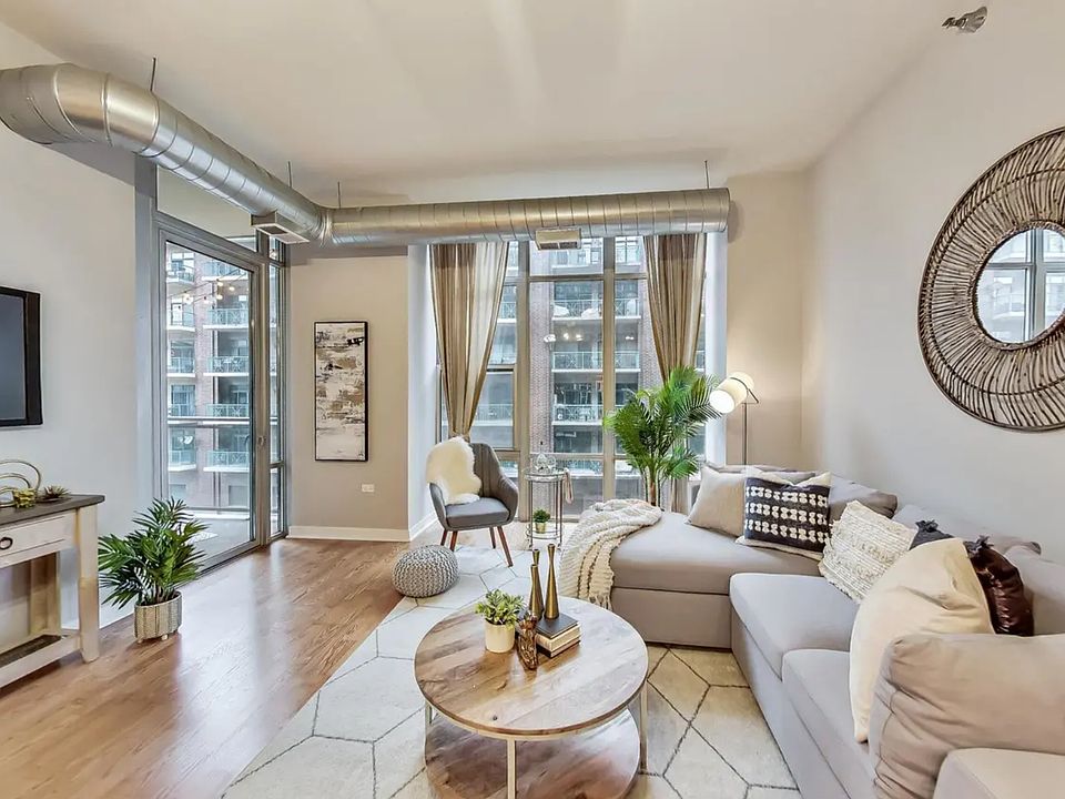 spacious living area with floor to ceiling windows, north facing