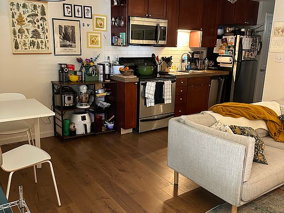Kitchen with dishwasher and built-in microwave. Full-size range.