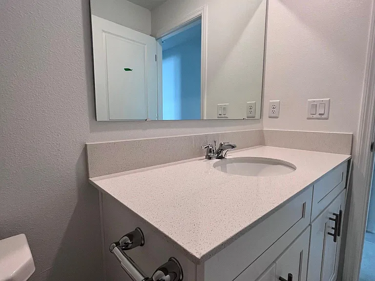 Second bathroom with linen closet
