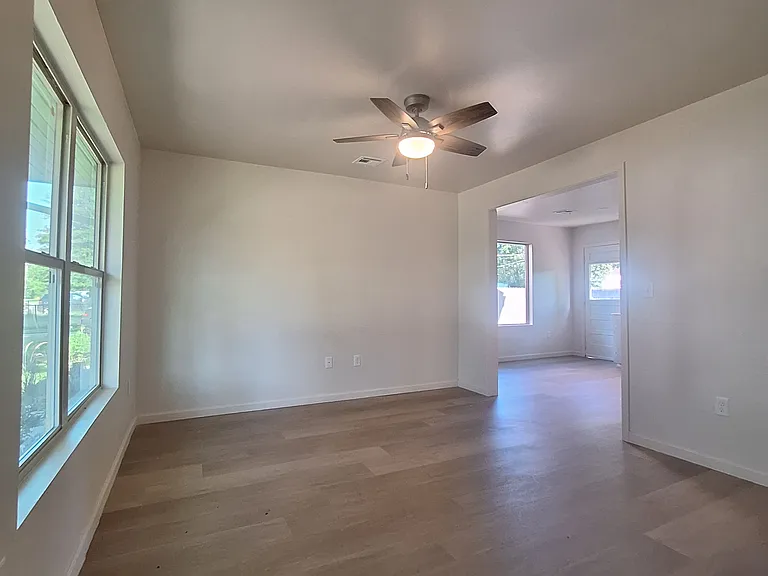 Living room leads to kitchen