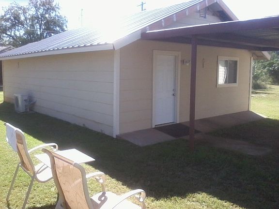 Metal Roof & covered parking.  Also has a ramp in front

