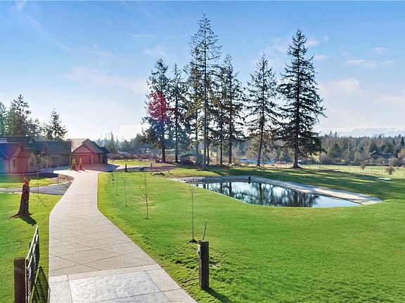 The curb appeal begins as you drive down the long driveway.