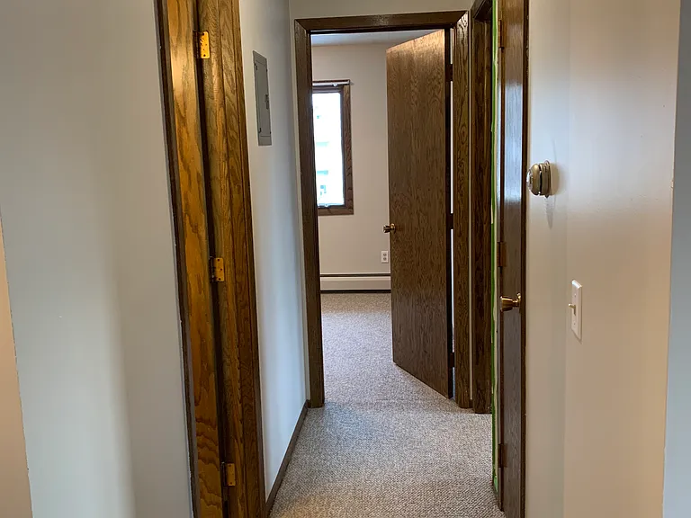 Hallway to bathroom and two bedrooms