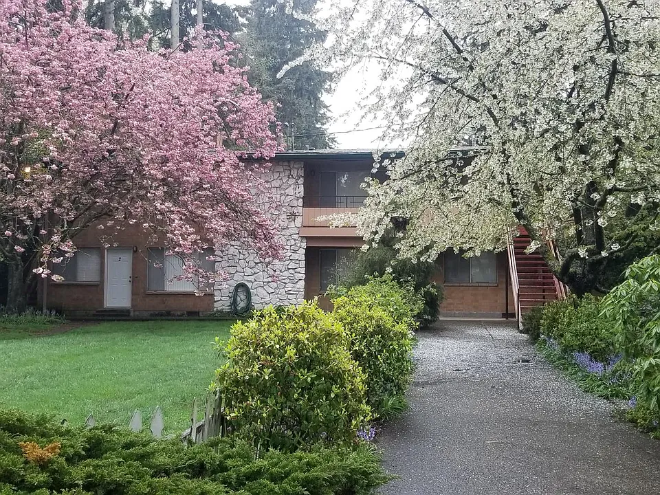 Whispering Firs Apartments entry taken Spring, 2020.