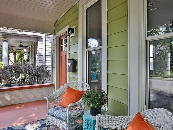 The tranquil covered porch leads into the open Living room/kitchen.
