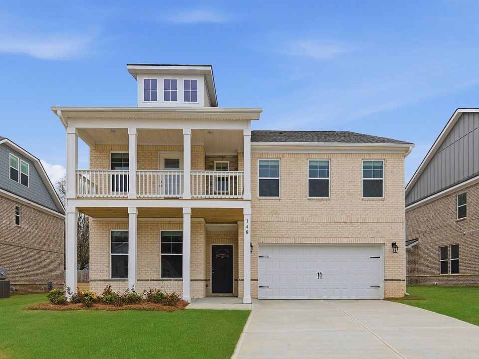 Wagener two-story brick home with spacious balcony and covered entry at Bowers Farm in McDonough, GA