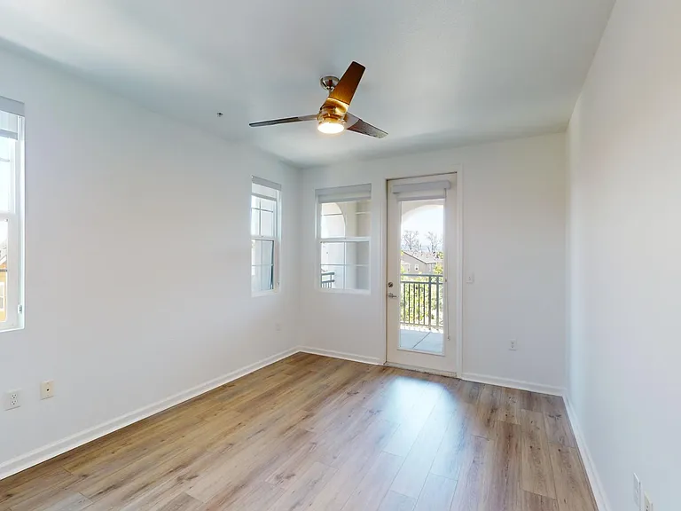 Spacious apartment Bedroom with Large Closet and Wood Style Flooring.
