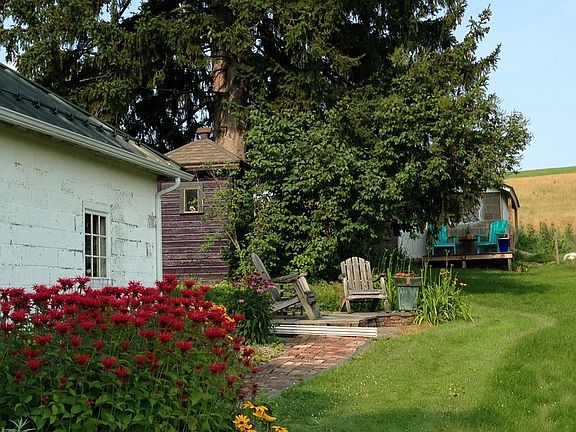 side of garage looking toward back of property, facing east