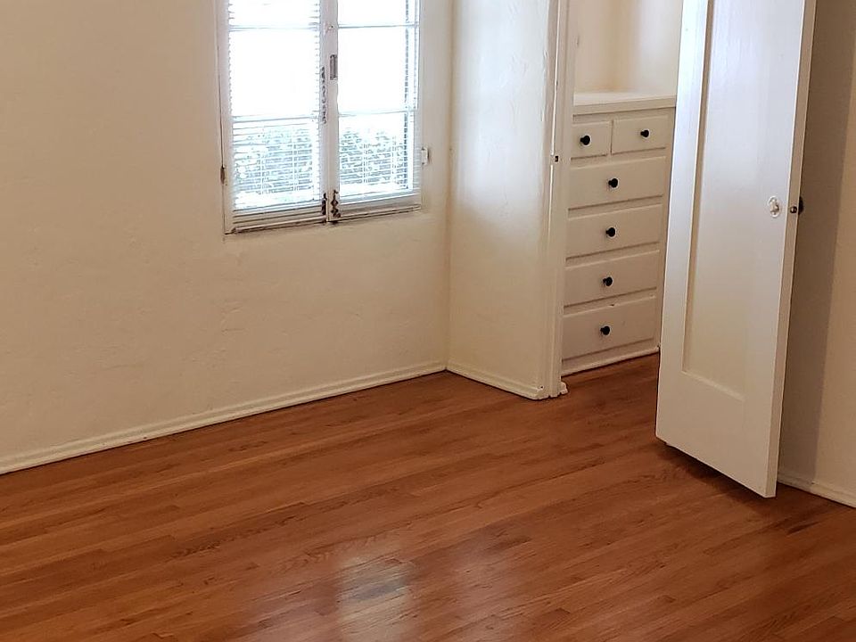 North bedroom with 2 walk-in closets & built-ins