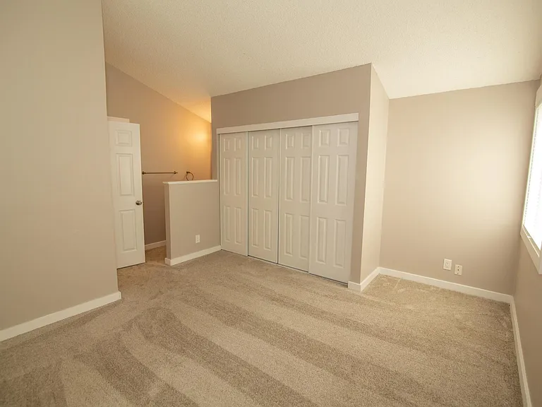 Master Bedroom with 4 door sliding closet.