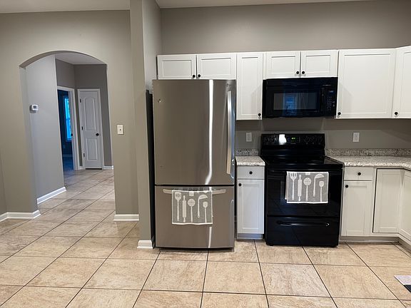 Large fridge with an ice maker.