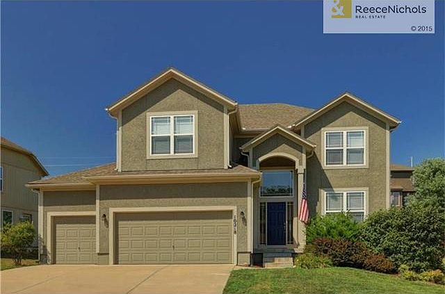 Great curb appeal with freshly painted front door.