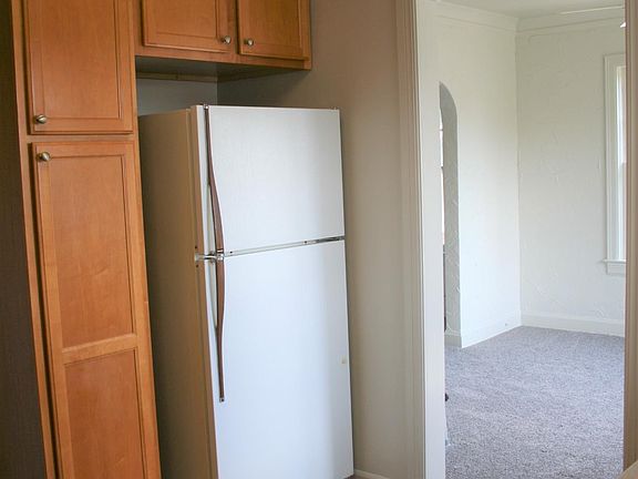 Kitchen leads to dining room.
Lots of storage space with pull-out pantry drawers. Formica counter tops.