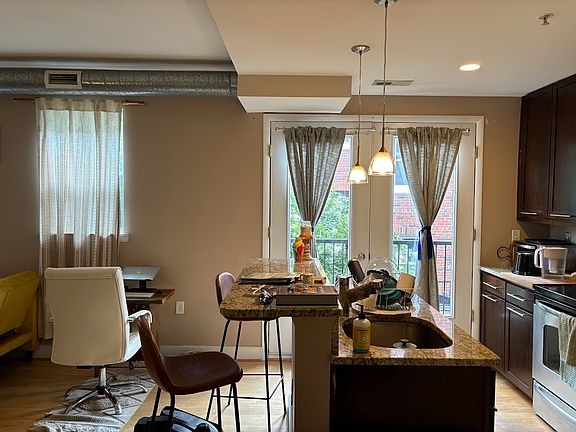 kitchen/breakfast bar... with juliet balcony that looks out into courtyard