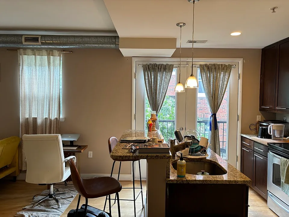 Kitchen/breakfast bar... with juliet balcony that looks out into courtyard