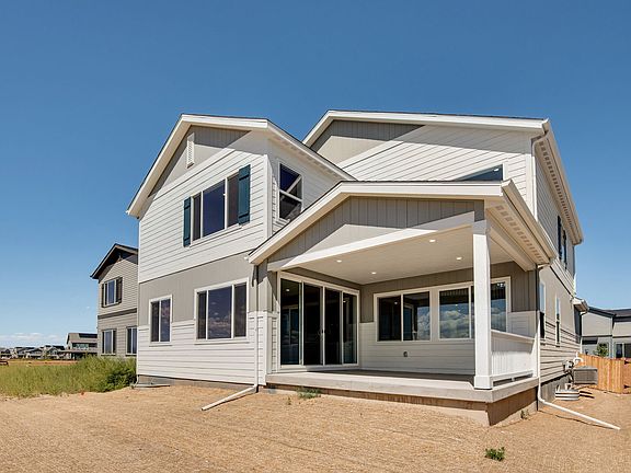 Rear exterior with covered patio and back yard
