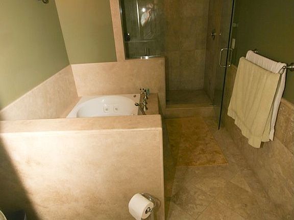 M/B - Travertine Jacuzzi Tub and Custom Steam Shower