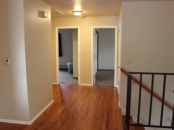 2 of 4 bedrooms looking down hall, newer carpet & doors