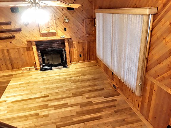 Hardwood floor and beautiful wooded room.