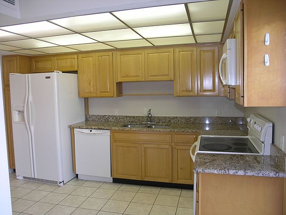 WOOD CABINETS GRANITE TOPS