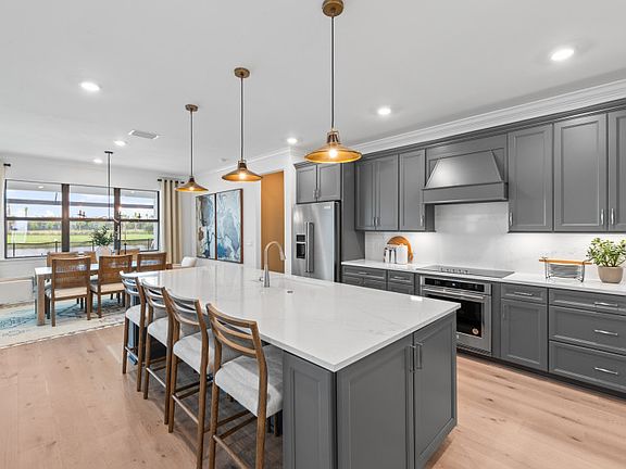 Oversized island in gourmet kitchen
