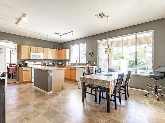 Large, spacious, open kitchen with plenty of room for cooking and gathering! Table seats 6.