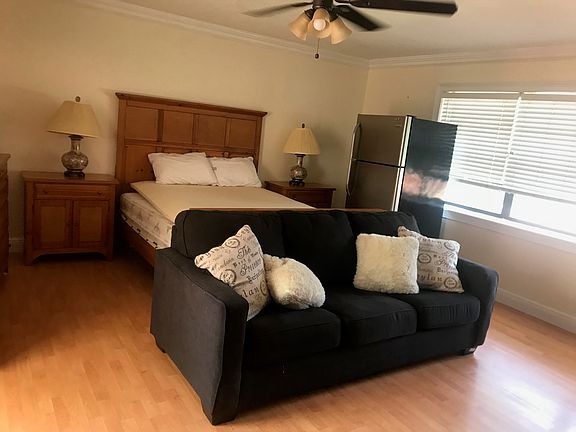 large master room furnished with queen bed set