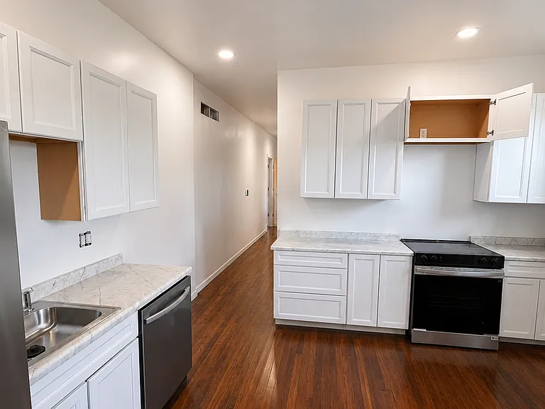 Updated kitchen with new appliances and cabinetry.