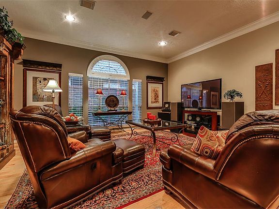 Den overlooks lush atrium - notice the privacy from neighbors!