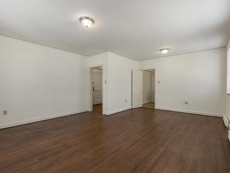 Raleigh Spacious bedroom with natural light and hardwood floors