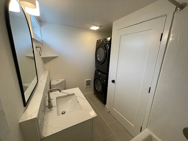 Bathroom with full size laundry in the unit