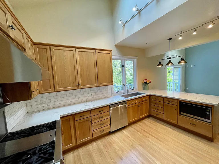 Updates: new stainless appliances, new counters/tile, paint in kitchen and family room, hardwoods refinished in 2022. (Photo 2022)