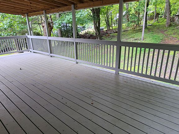 LARGE covered deck just outside of kitchen & living room areas
