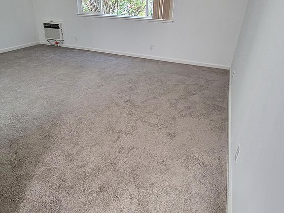 Carpeted living room - taken from entryway