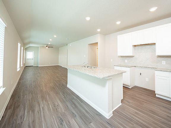 Kitchen to Dining Area and Family Room