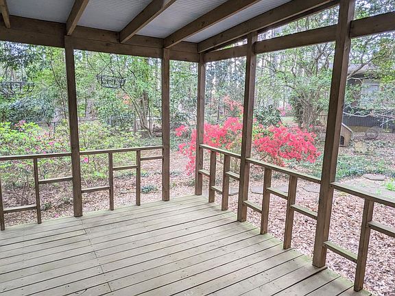 Enjoy the azaleas from the screened porch.