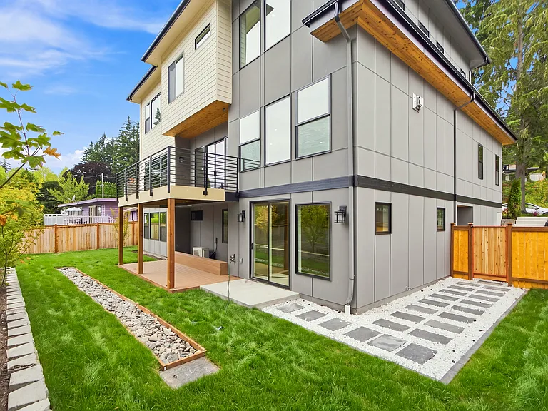 Flat ,fully fenced backyard with Deck