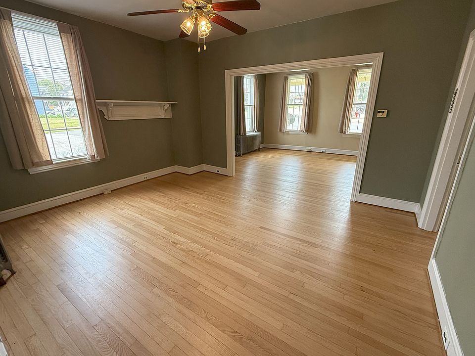 Dining room looking through to living room; or double size living room. Freshly sanded and finished floors!